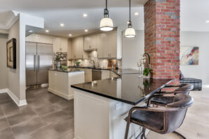 OUR BLOGS Modern luxury kitchen with brick accent and island seating